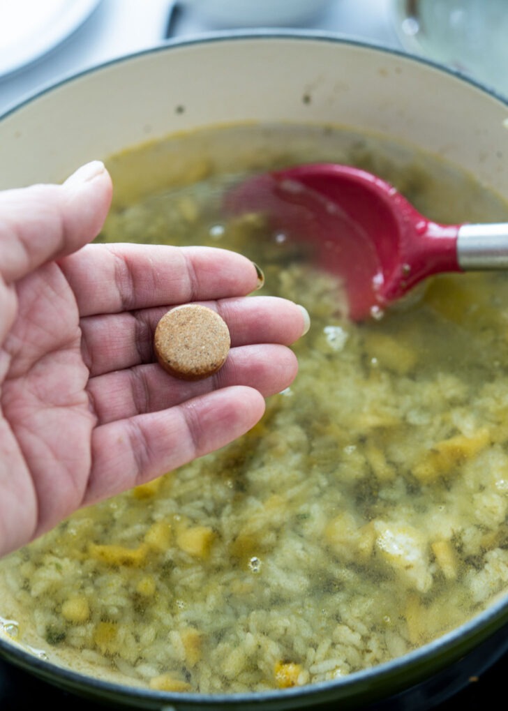 Adding water and a stock coin to the porridge