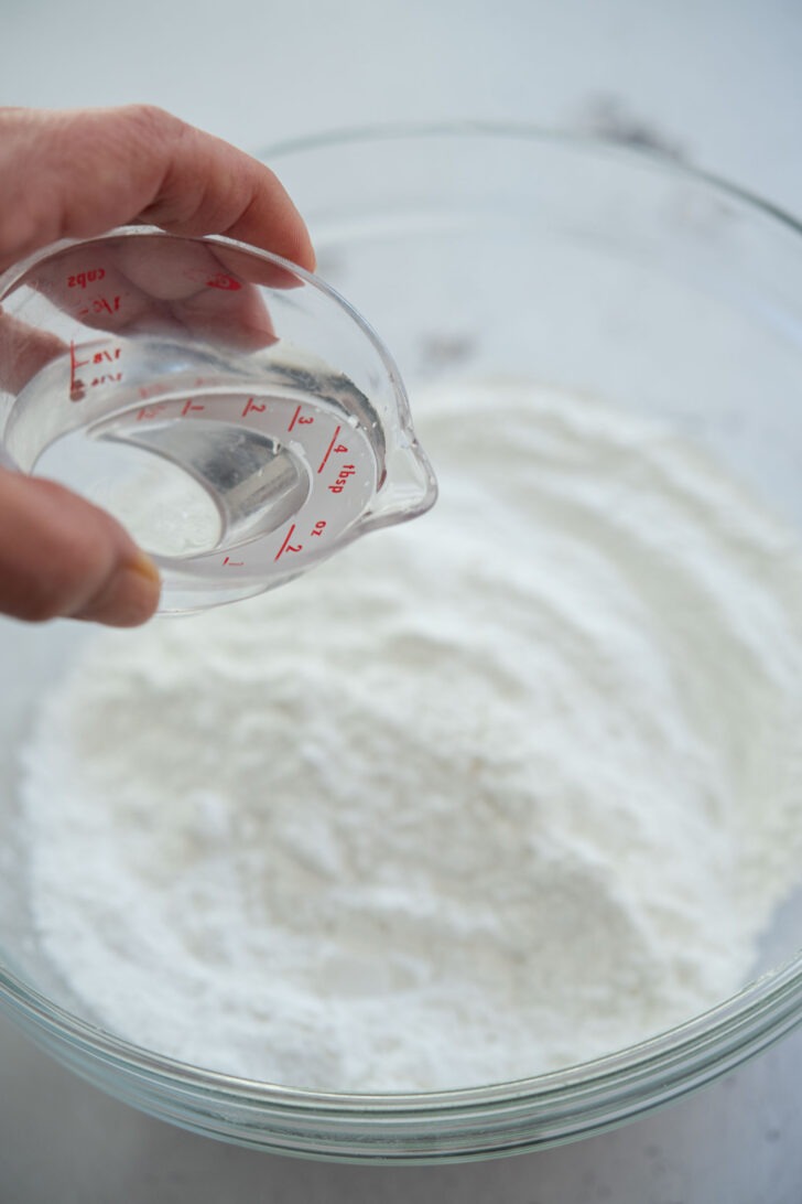 Adding water to rice flour