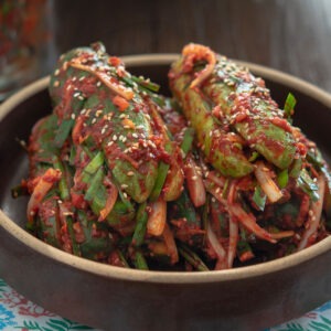 Stuffed cucumber kimchi (oi sobagi) made with cucumbers, garlic chives, and Korean chili flakes