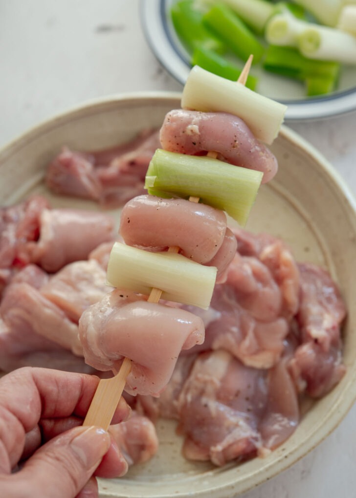 Chicken thigh and Korean leek pieces skewered alternately for dakkochi