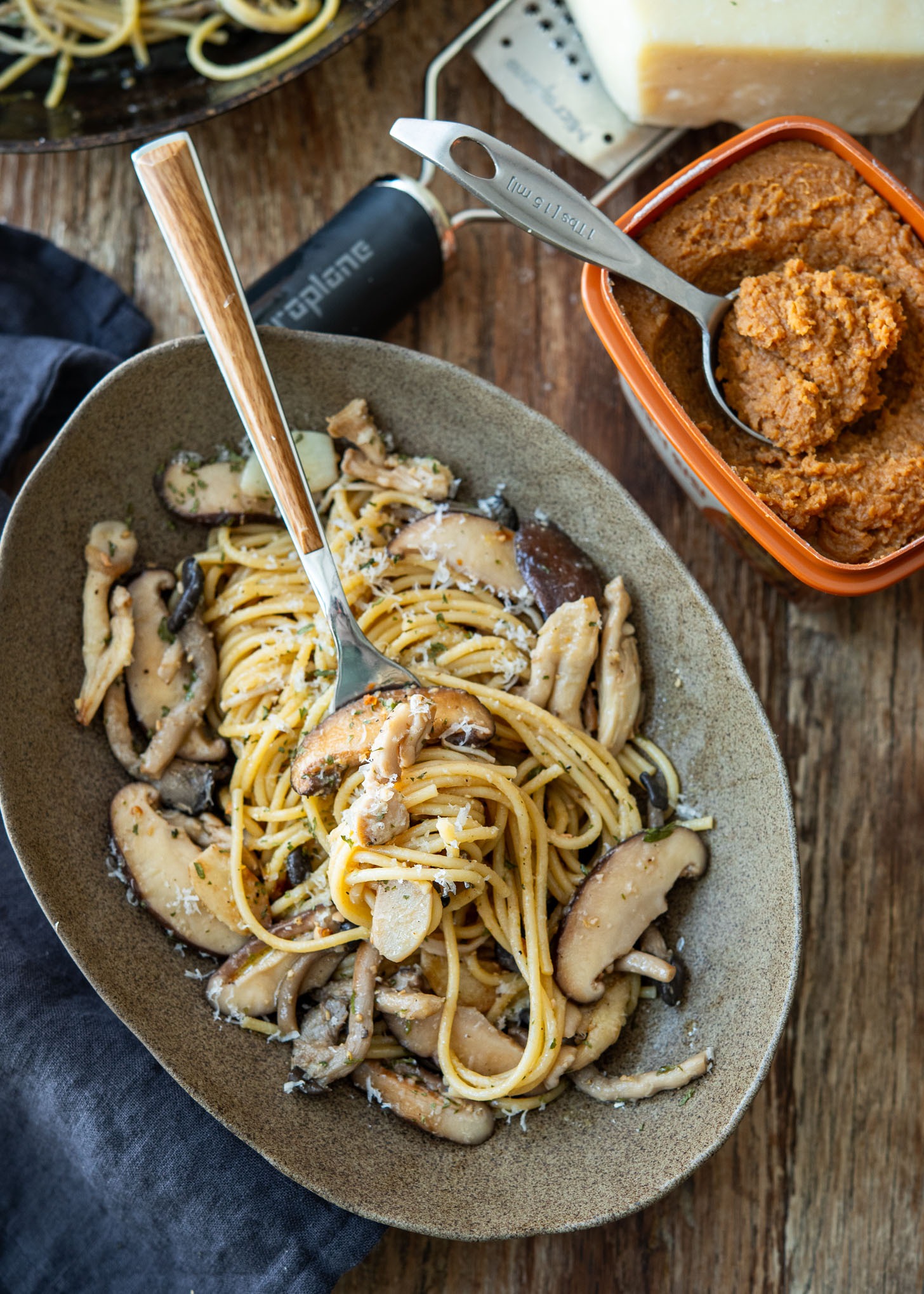 Fork twirling doenjang spaghetti with mushrooms