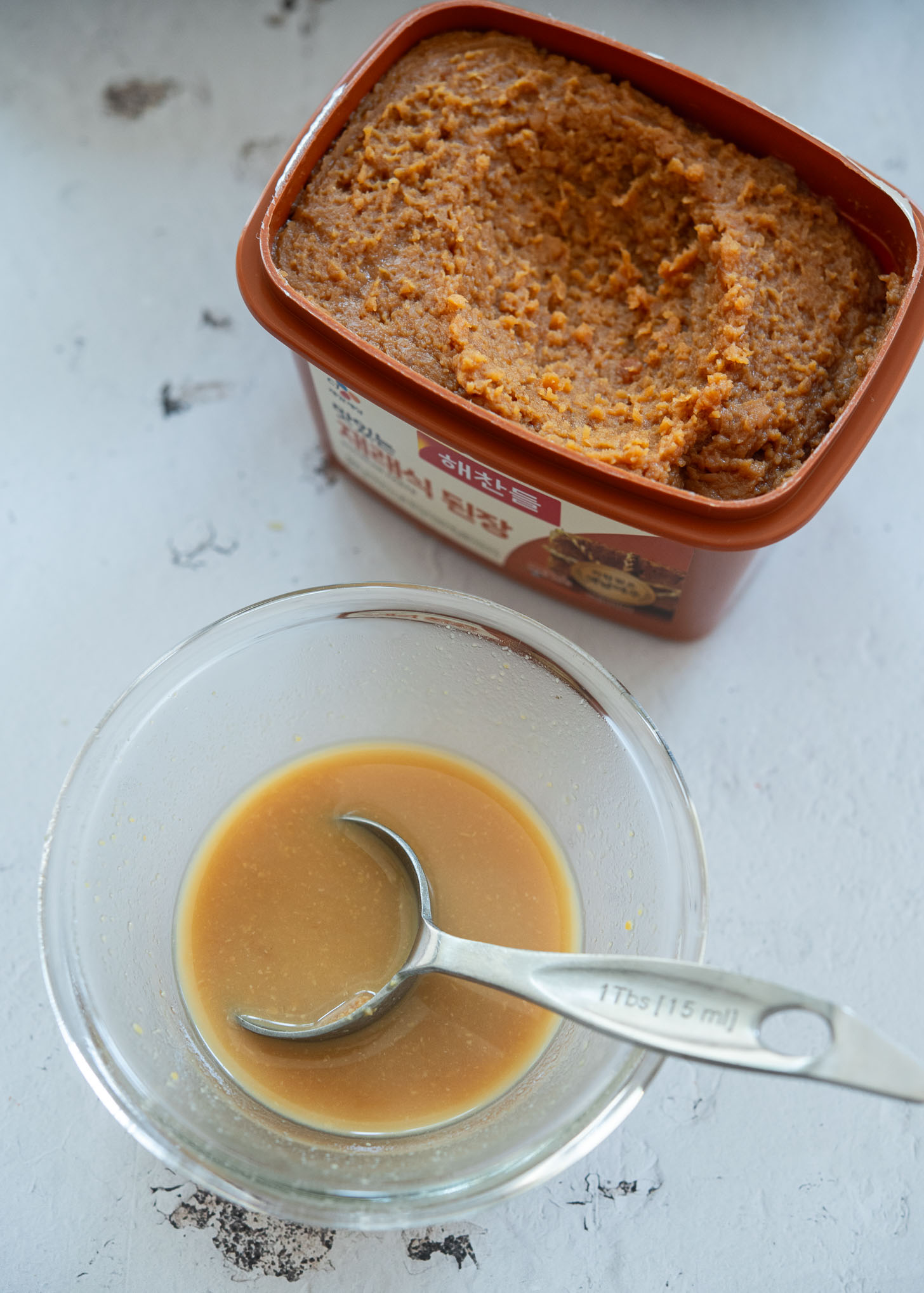 Doenjang paste mixed with water in a bowl