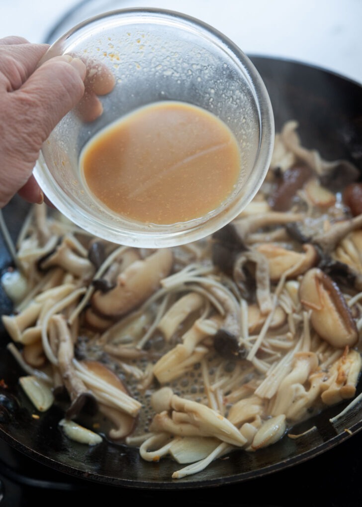 Diluted doenjang sauce poured over mushrooms