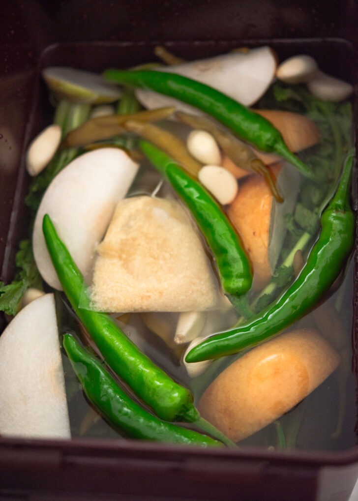 Dongchimi brine poured over the radishes