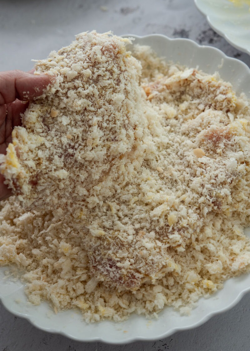 Donkatsu pork cutlet coated with coarse panko breadcrumbs before frying