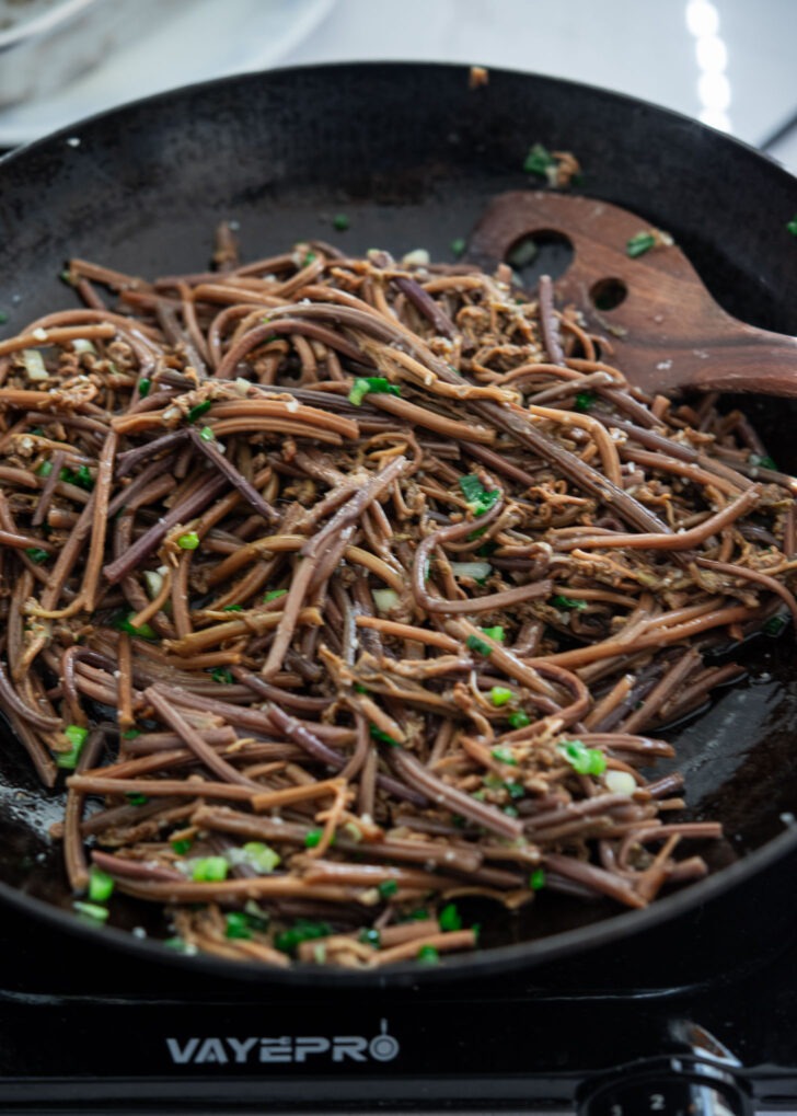 gosari namul finished with green onion and sesame seeds