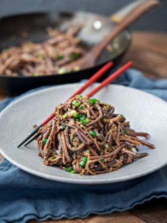 Korean gosari namul (bracken fern) served as a side dish with sesame oil, green onion, and sesame seeds