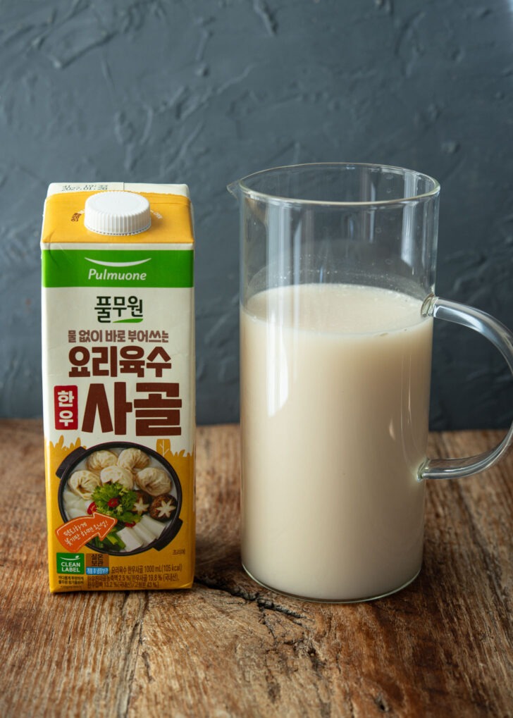 Packaged bone marrow soup stock showing its milky stock base