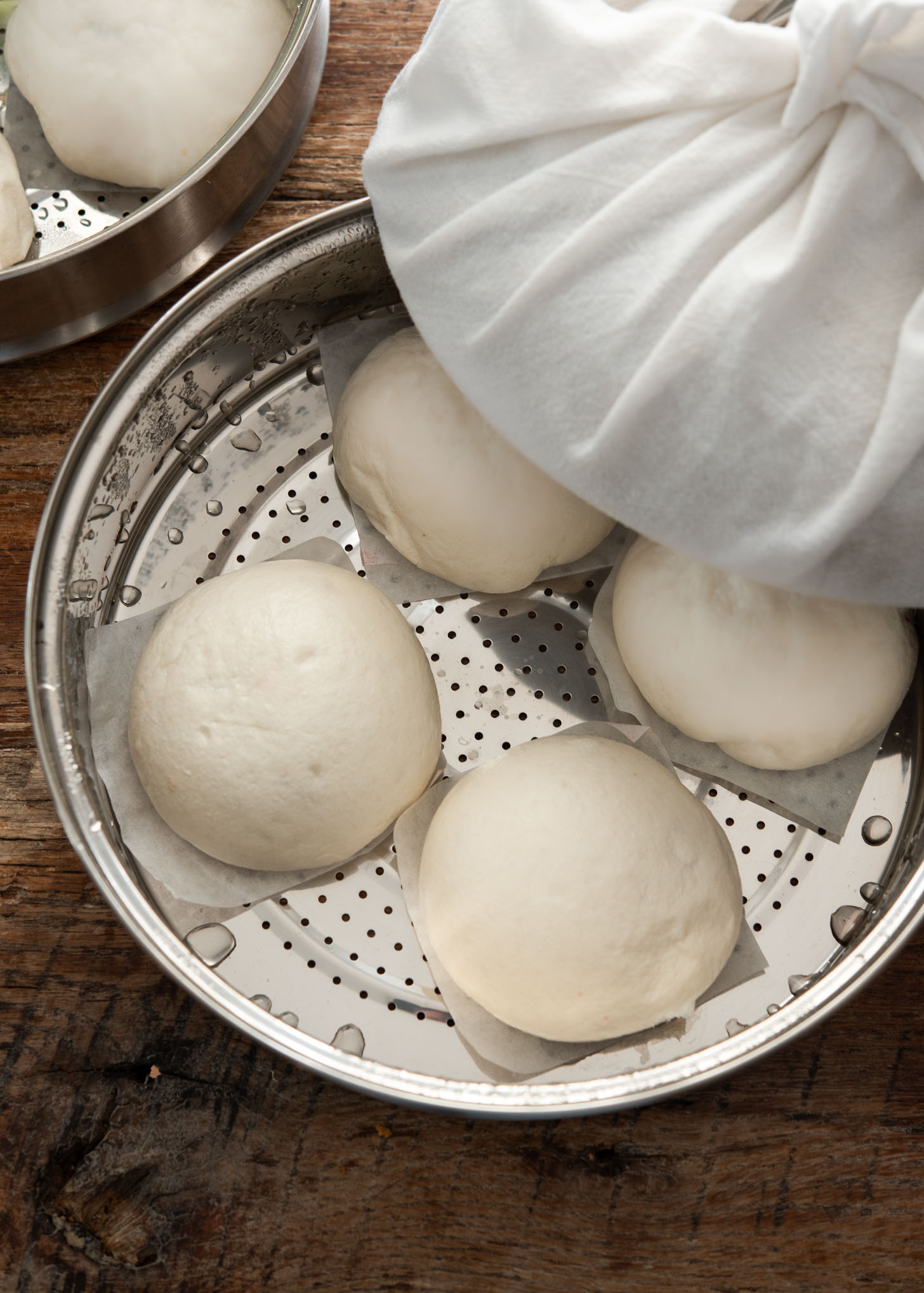 Freshly steamed hoppang buns with fluffy texture in a steamer