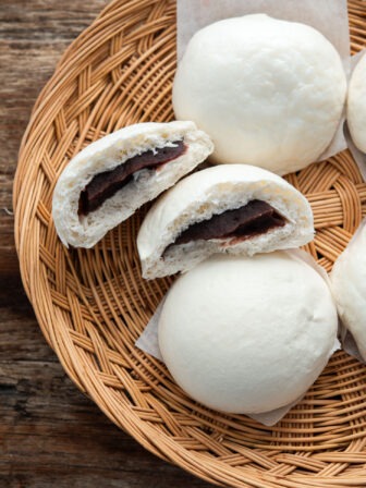 Hoppang filled with sweet red bean paste arranged in a woven tray