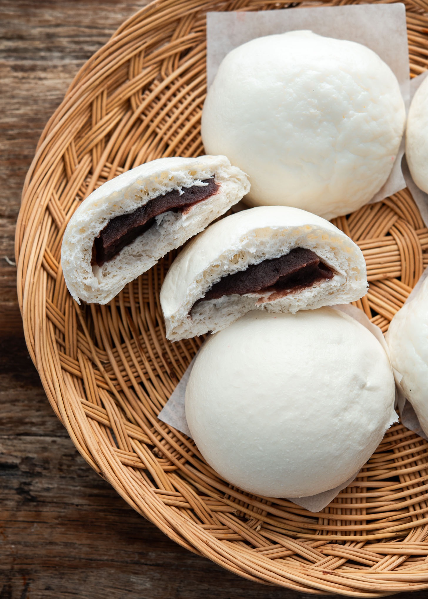 Hoppang filled with sweet red bean paste arranged in a woven tray
