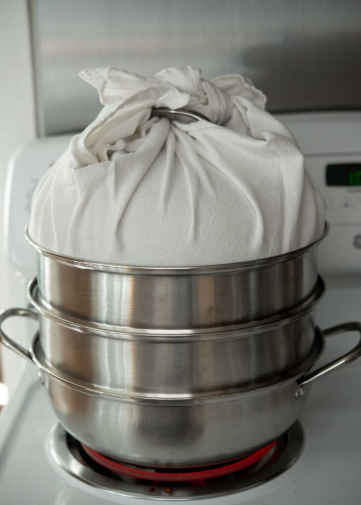 Hoppang steaming in a cloth-covered steamer to prevent dripping