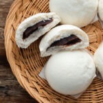 Hoppang filled with sweet red bean paste arranged in a woven tray