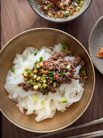 Korean beef rice bowl with tender radish and ground beef bulgogi topping