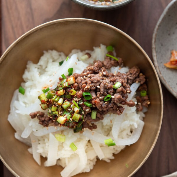 Korean beef rice bowl with tender radish and ground beef bulgogi topping
