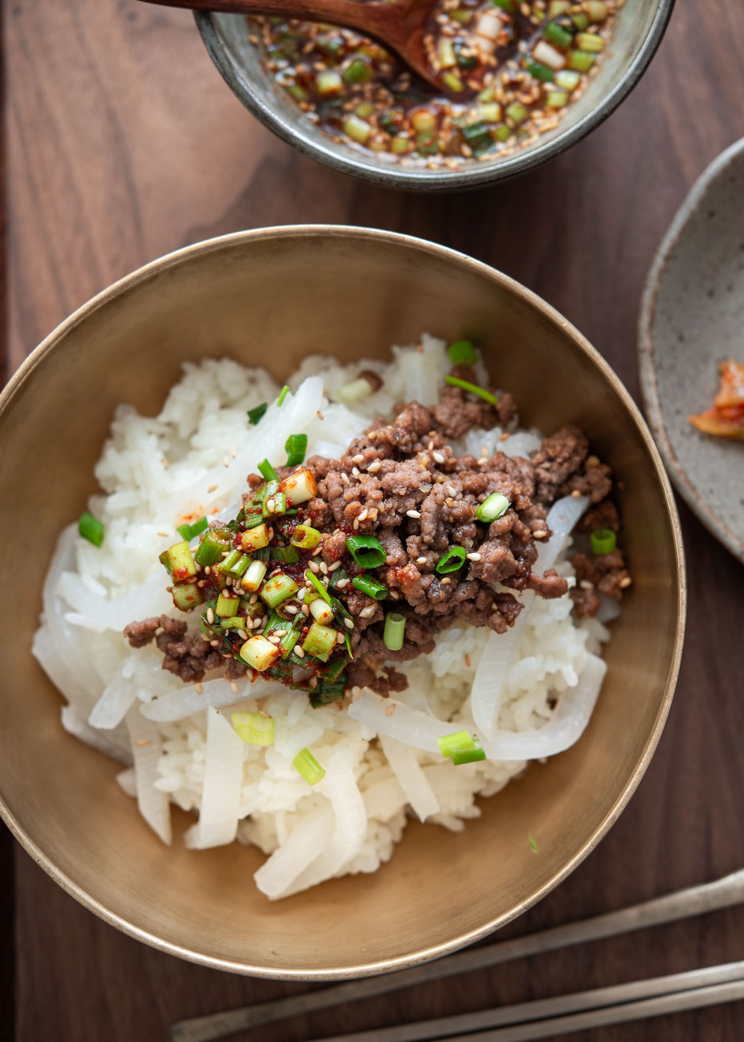 Korean beef rice bowl with tender radish and ground beef bulgogi topping
