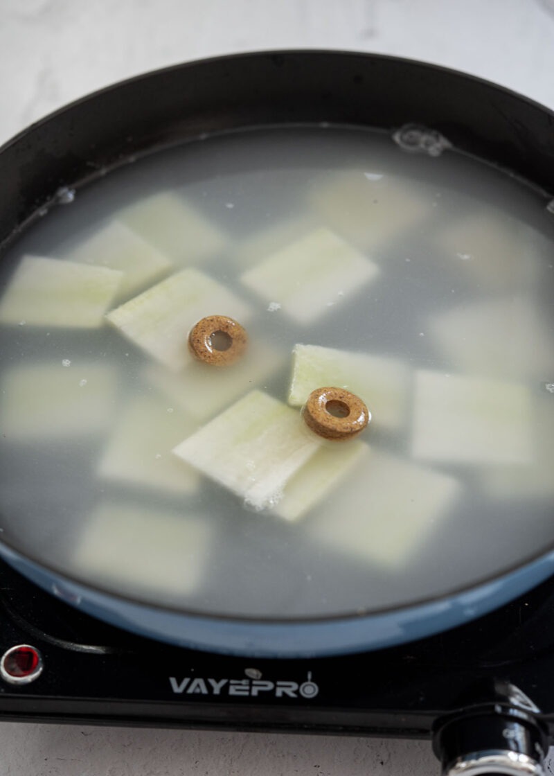 Radish simmering with anchovy stock coins for Korean fish stew base