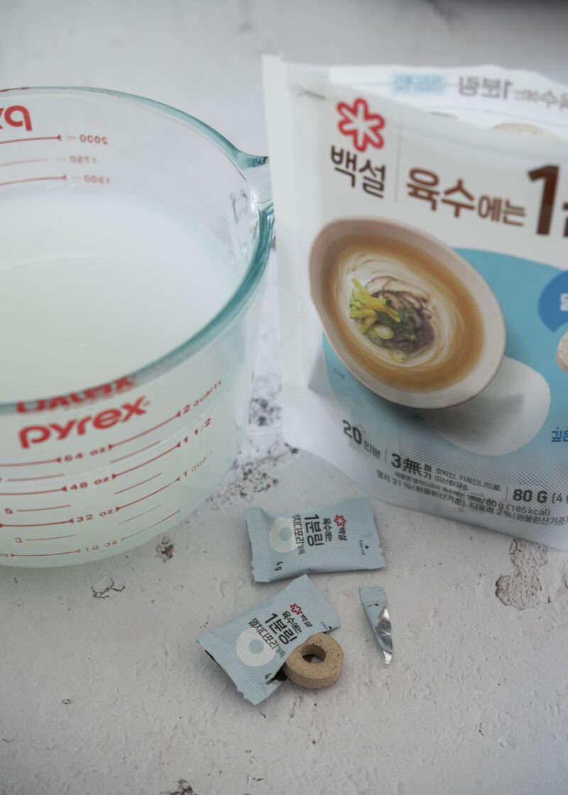 Rice rinse water and anchovy stock coin used for Korean maeuntang broth
