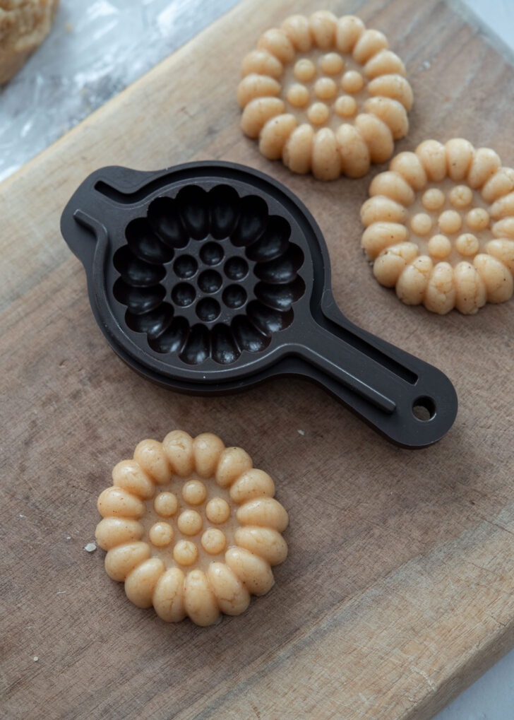 Yakgwa mold creating the classic pattern on Korean honey cookies