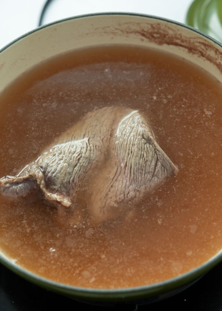 Simmering beef in Korean beef stock base