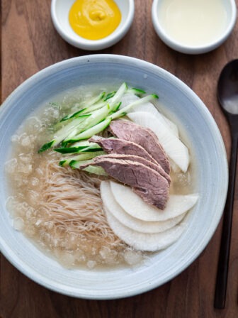 mul naengmyeon korean cold noodle soup with icy broth and toppings