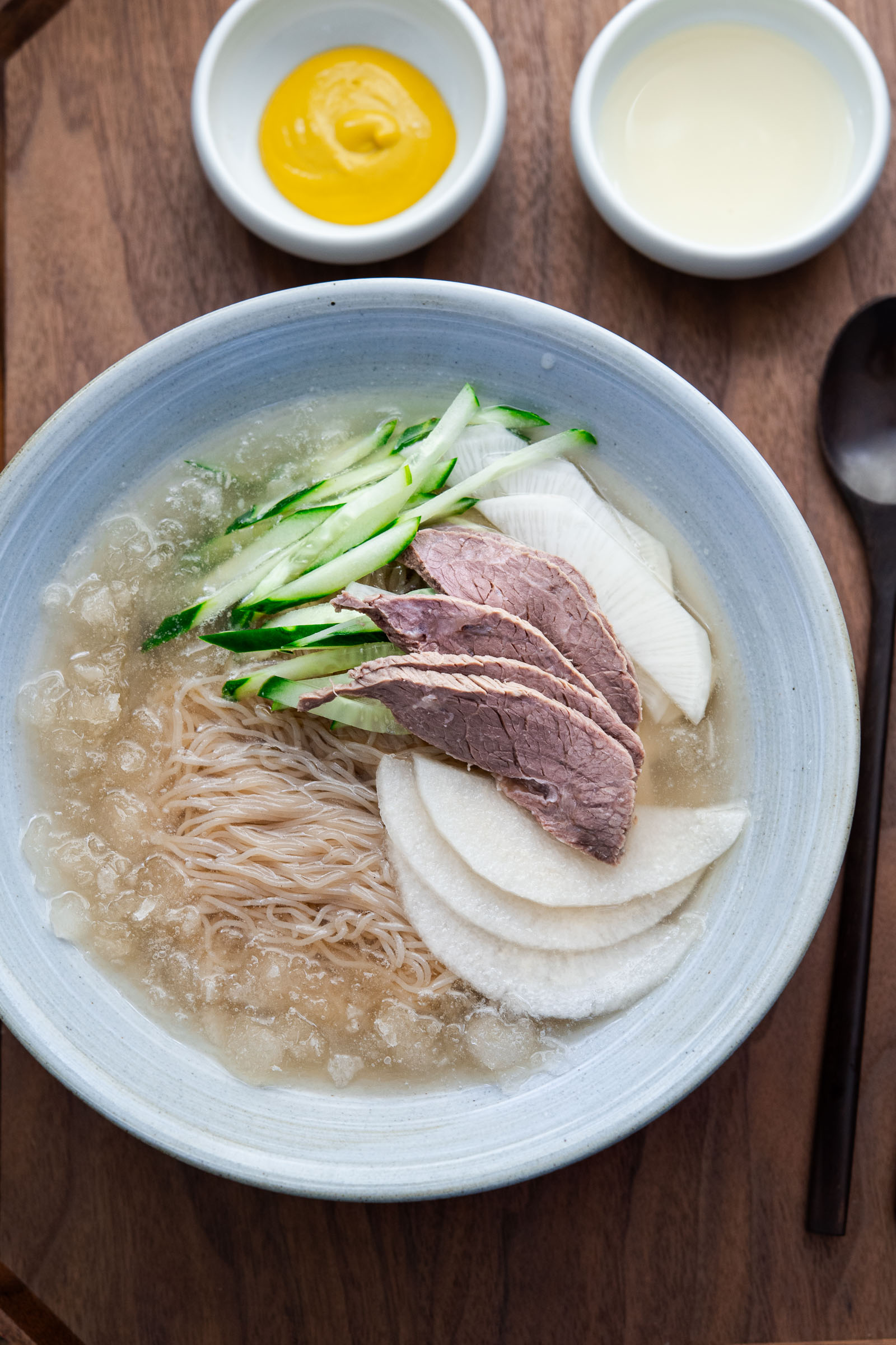 mul naengmyeon korean cold noodle soup with icy broth and toppings