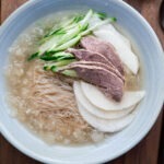 mul naengmyeon korean cold noodle soup with icy broth and toppings