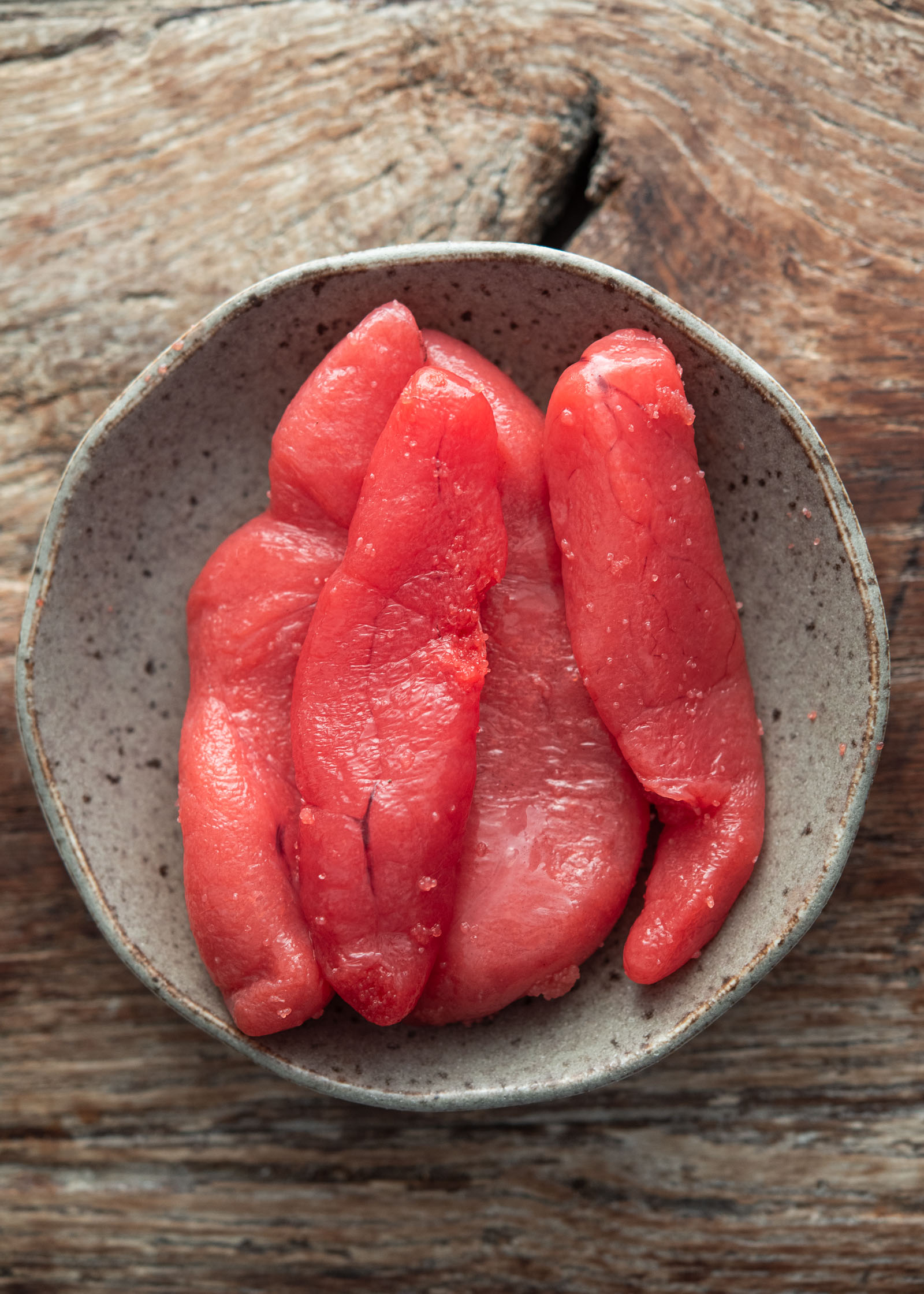 Korean myeongran-jeot pollock roe in a small bowl