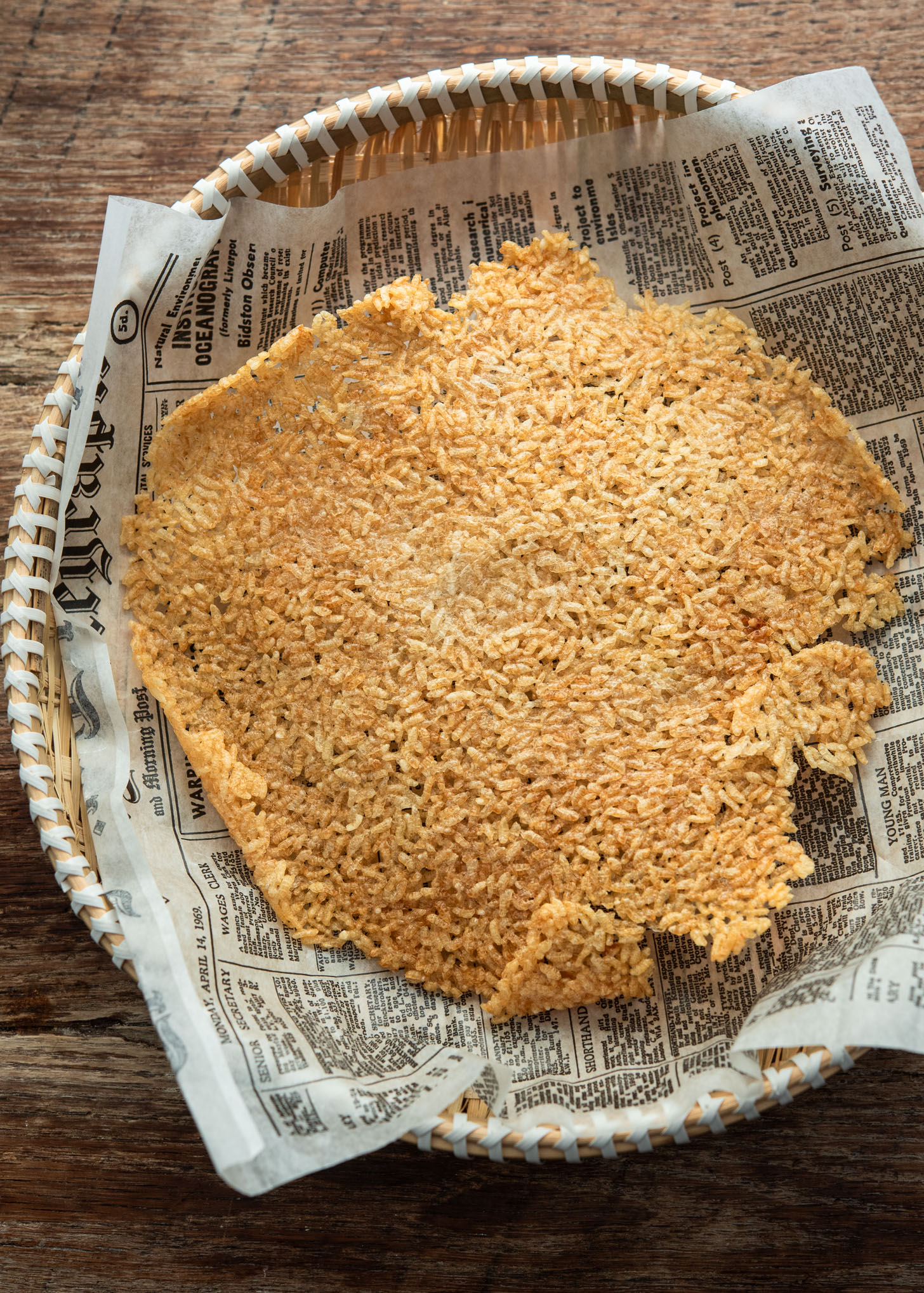 Crispy golden nurungji (Korean scorched rice) served in a small woven basket