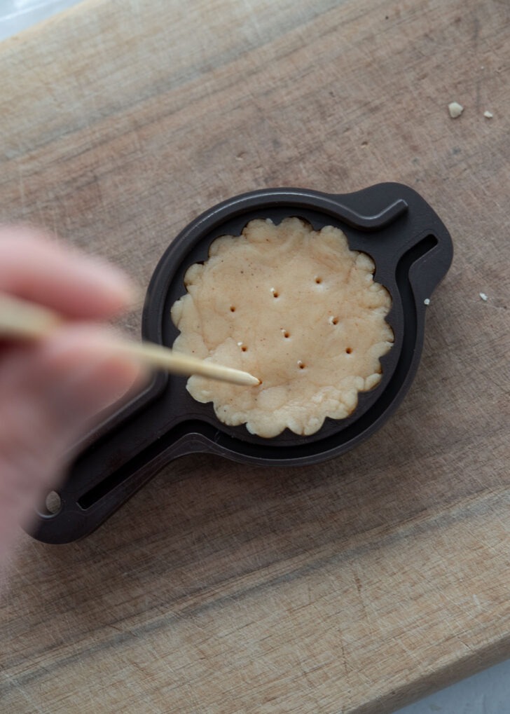Poking holes in the back of the yakgwa dough with a toothpick