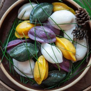 Colorful songpyeon Korean half-moon rice cakes with pine needles