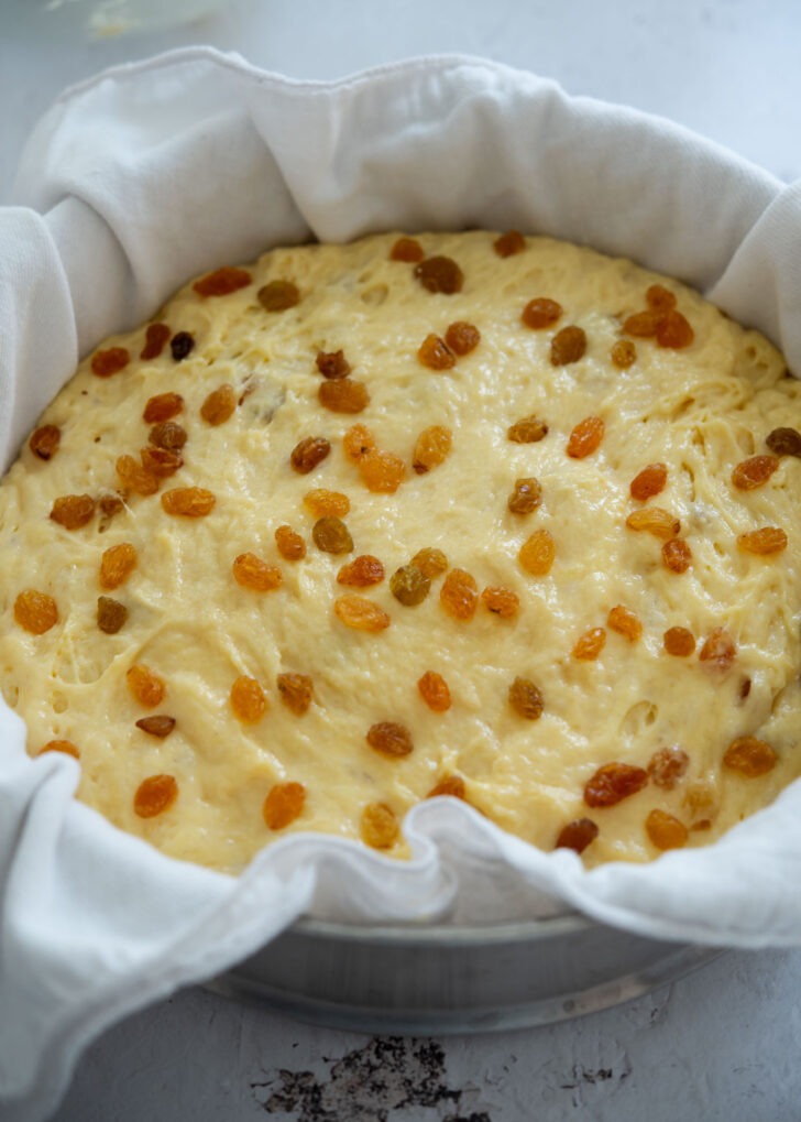 Sulppang batter poured into a cloth-lined steamer basket ready for steaming