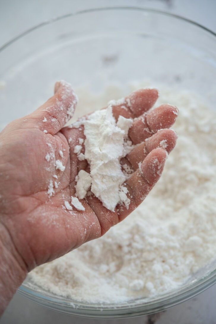 Squeezing rice flour mixture to test texture