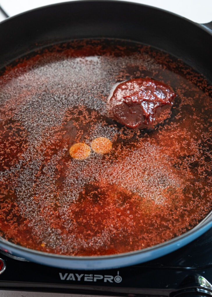Tteokbokki sauce ingredients mixed in a skillet