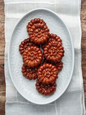 Yakgwa Korean honey cookies arranged on a white plate