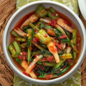 Yeolmu kimchi made with young Korean radish greens in light spicy brine, served in a bowl