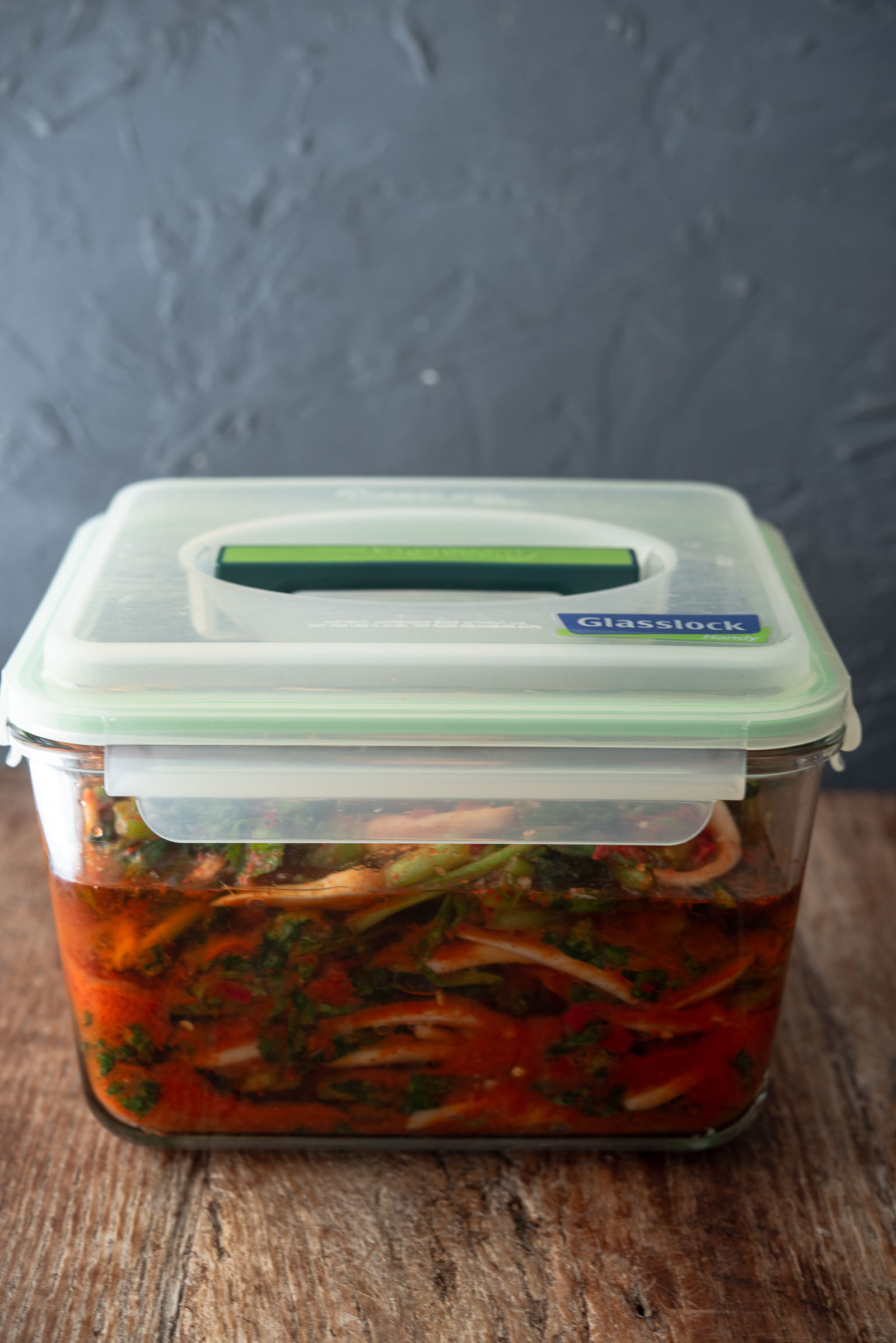 Yeolmu kimchi in an airtight container ready to ferment at room temperature