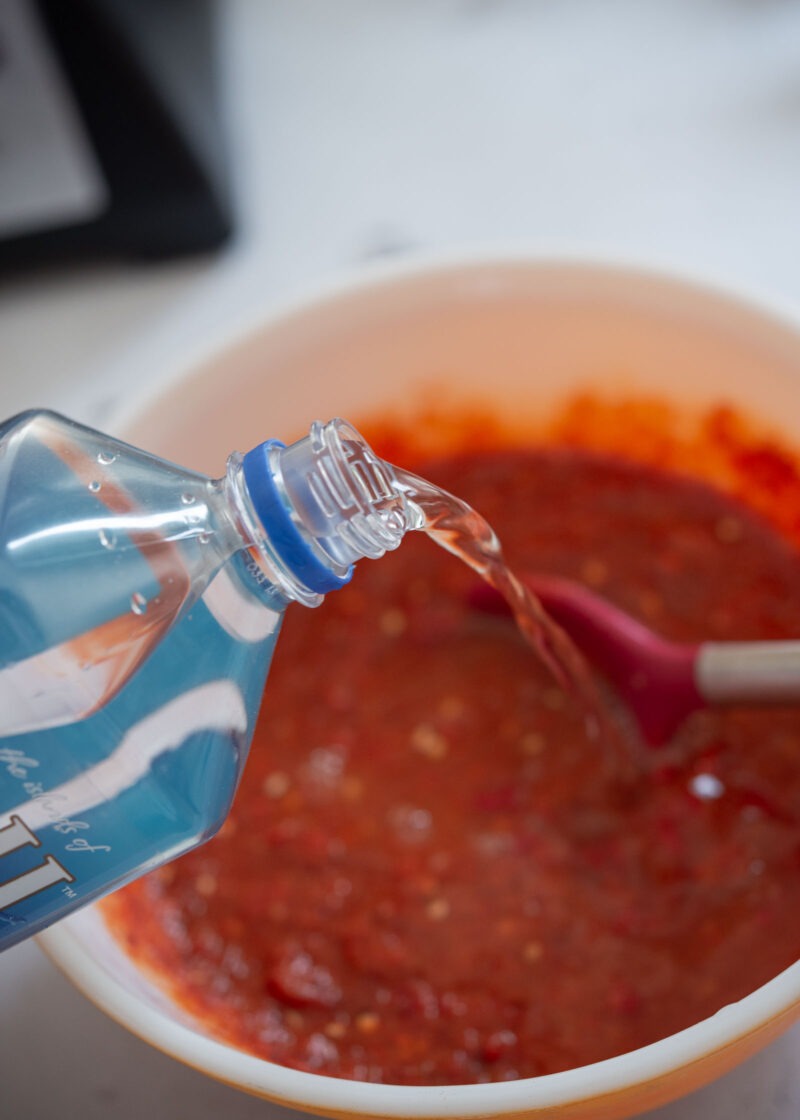 Adding mineral water to the seasoning paste