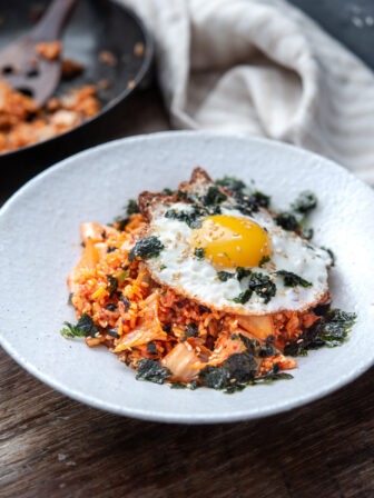 Classic kimchi fried rice topped with a sunny-side-up egg and roasted seaweed crumble
