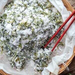 Fluffy Korean mugwort rice cake (ssuk beomul) with chopsticks