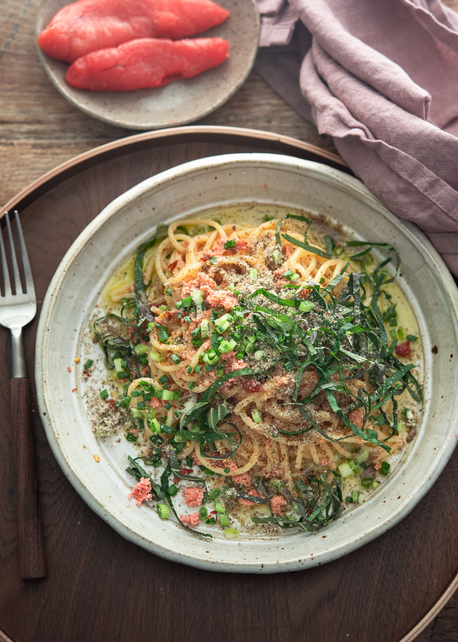 Mentaiko pasta made with Korean pollock fish roe, topped with green onion and perilla leaves