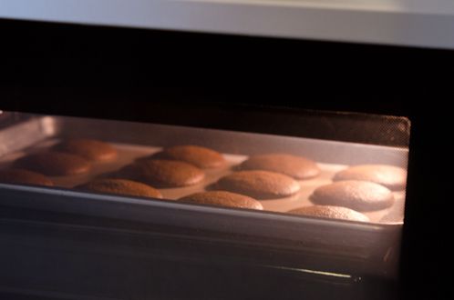 Soft ginger cookies are baked in an oven,